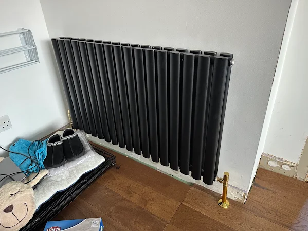 Completed radiator installation by TMS Plumbing & Heating